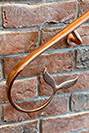 Fish tail copper handrail for a swimming pool