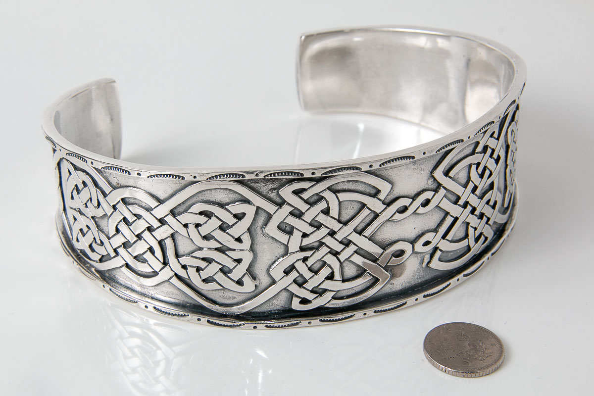 Large silver arm torc with celtic knotwork 