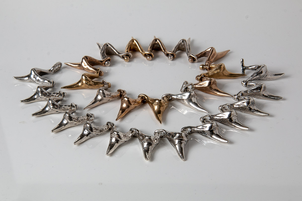 Handmade silver and bronze mako shark tooth bracelets 