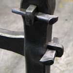 Traditional woodworking wedged joint in steel