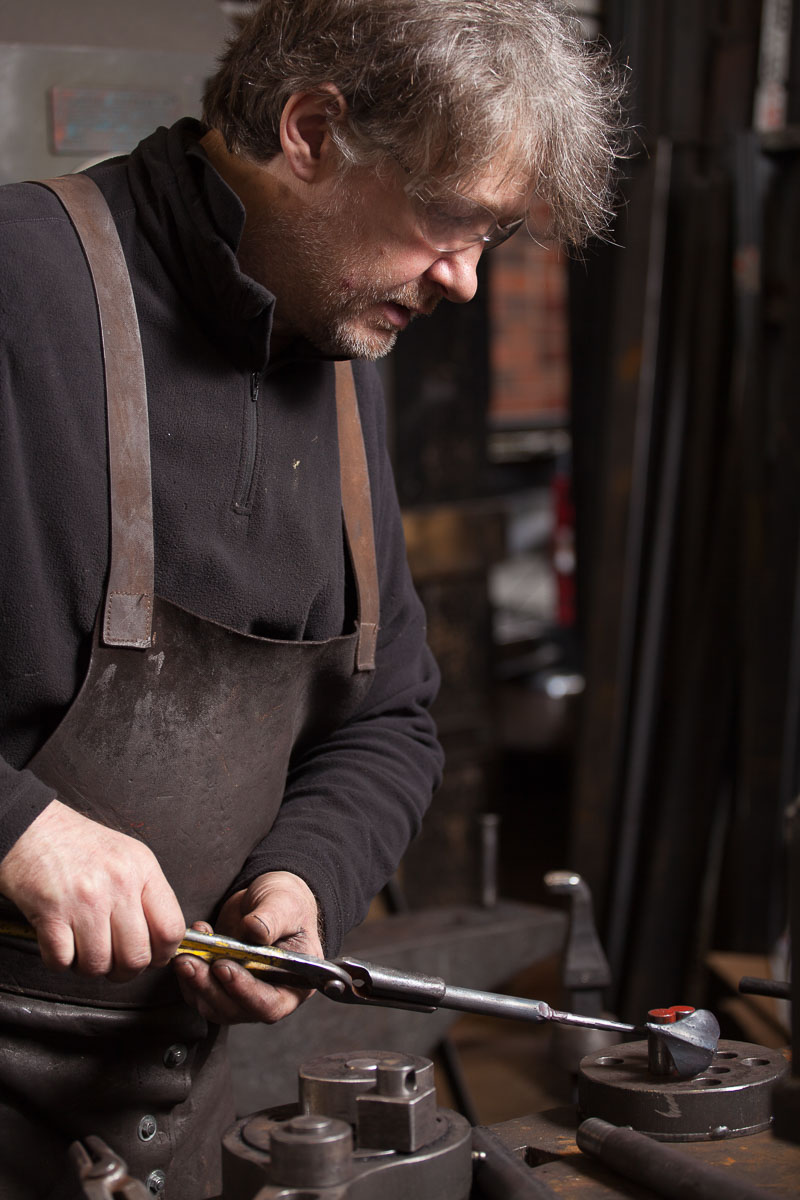 David Hyde contemporary artist blacksmith shaping a leaf 