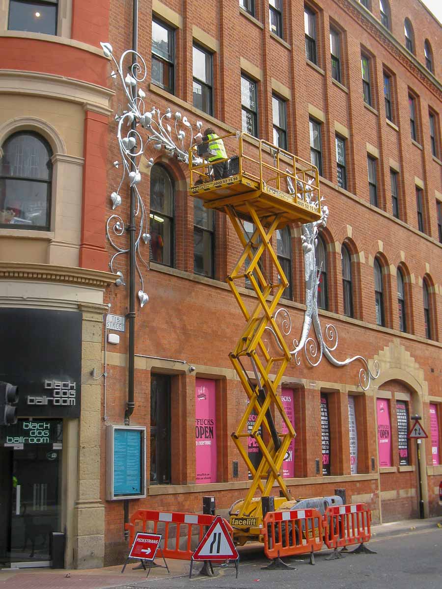 Installing a large tree sculpture outside Affleck's Palace Manchester
