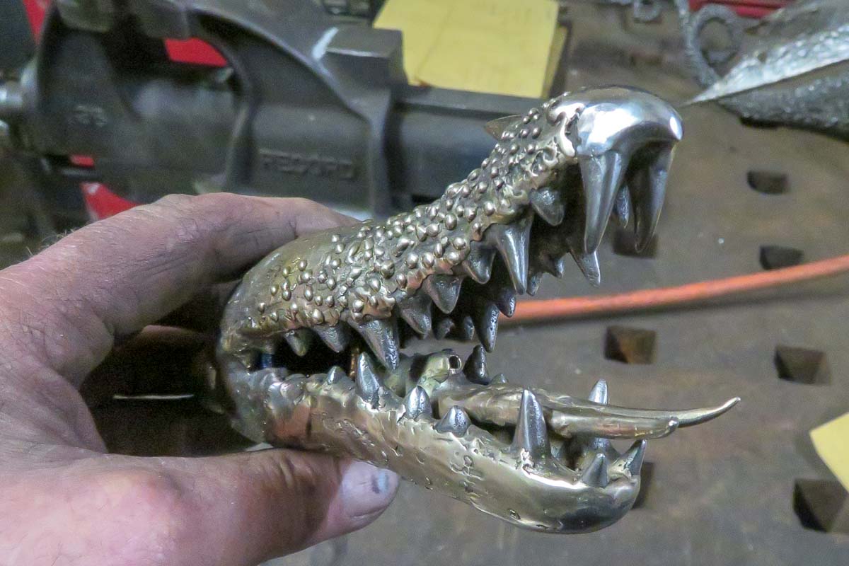 stainless steel dragon teeth and a fire breathing nozzle 