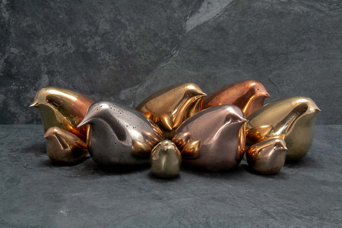 Copper bronze and cupronickel stylised bird sculptures