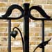 Wrought iron gates themed around 'reclaimed by nature'
