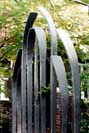 contemporary forged steel arch gate 