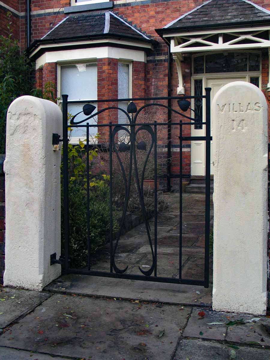 Edwardian wrought iron garden gate matching stained glass 
