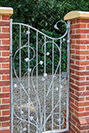 Pedestrian gate with a stylised ivy design
