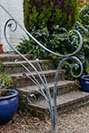 A handrail with a flowing and naturalistic theme