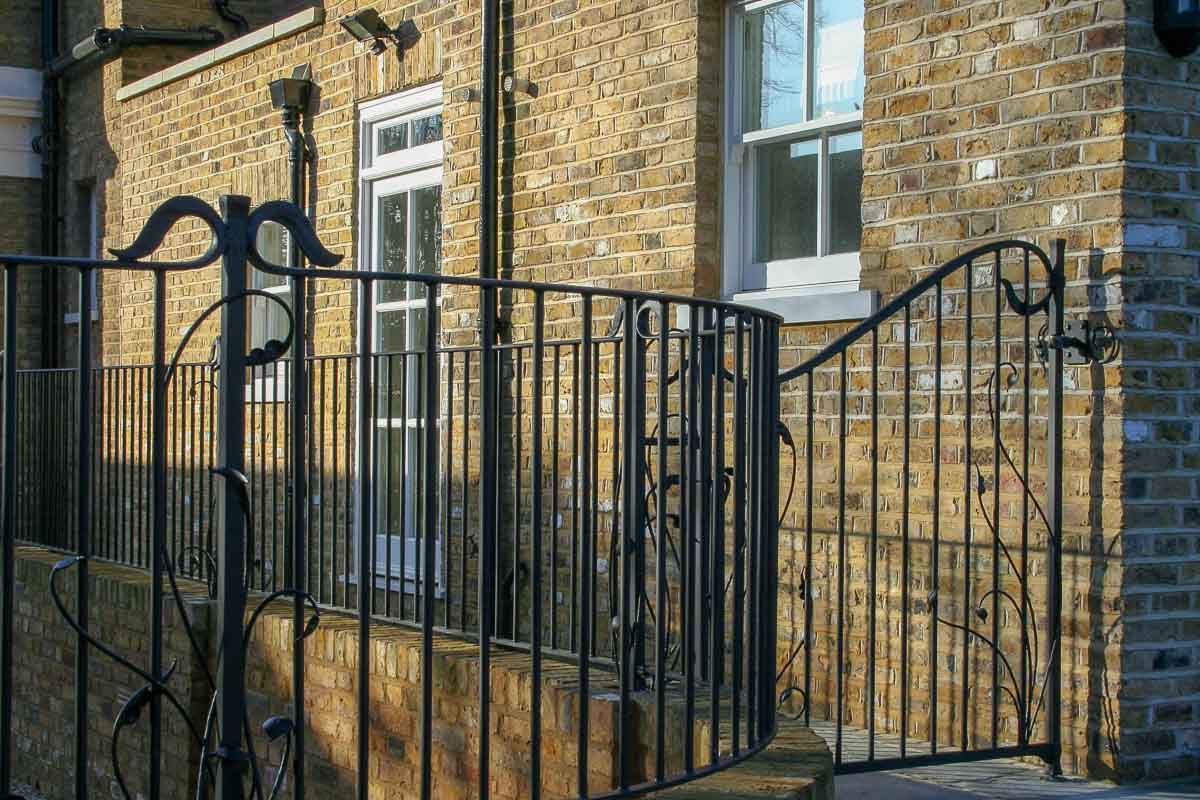 Understated detailed but wrought iron railings 