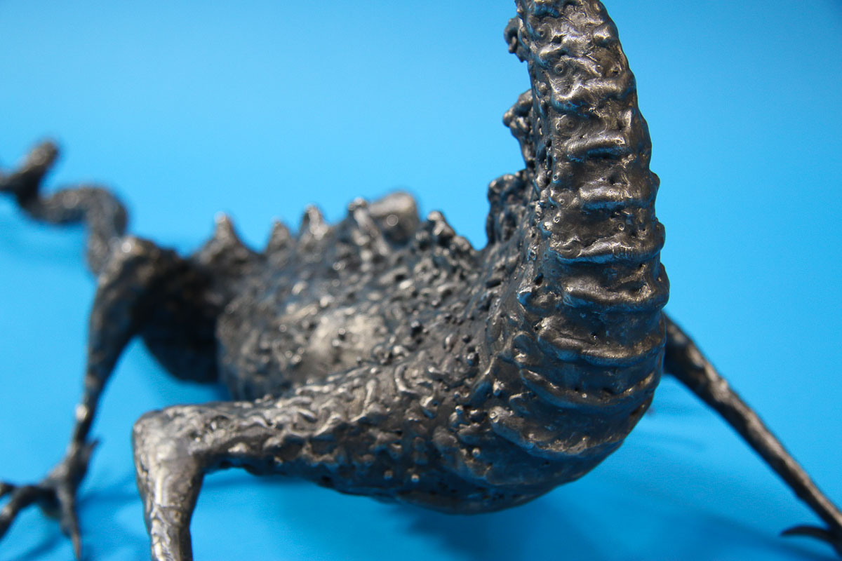 Textured metal dragon sculpture 