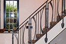 Wrought iron stair balustrade inspired by the Arts and Crafts movement