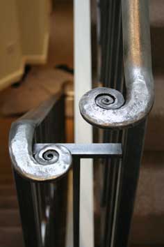 interesting wrought iron stair handrail