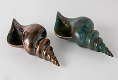 Polished and patinated bronze shells