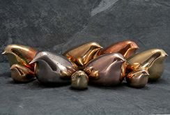 polished copper and bronze bird sculptures