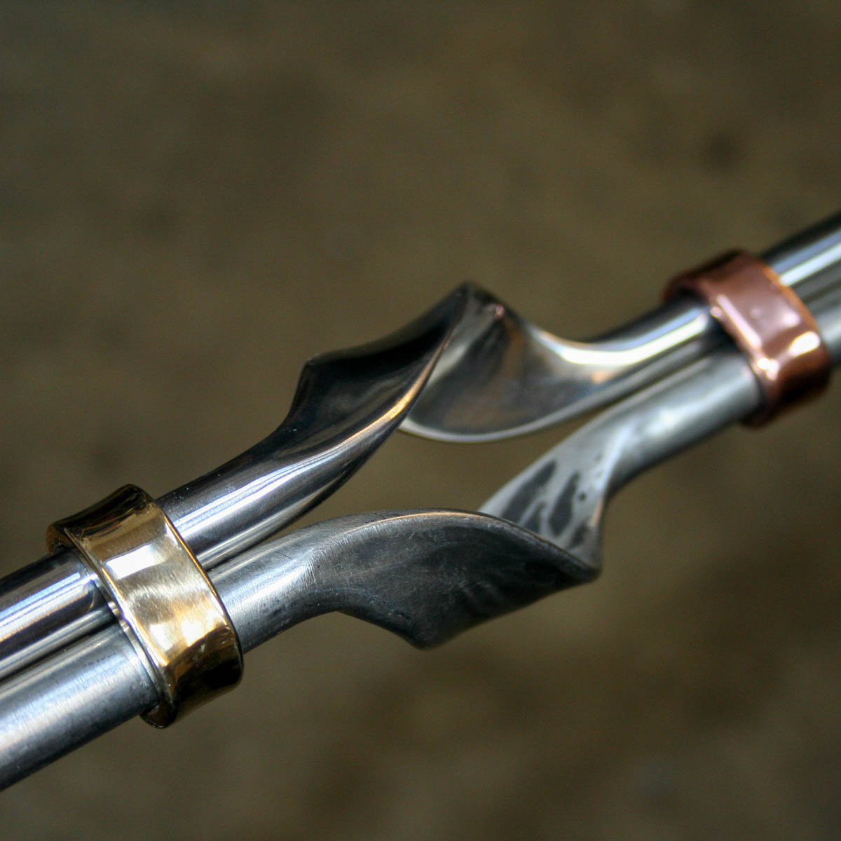 Forged and satin polished stainless steel with copper and bronze detailing