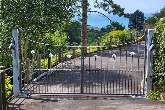 Driveway gates featuring calla lilies and snowdrops