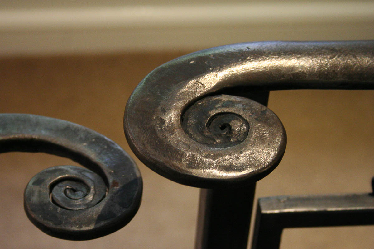 Forged textured metal handrail volute 