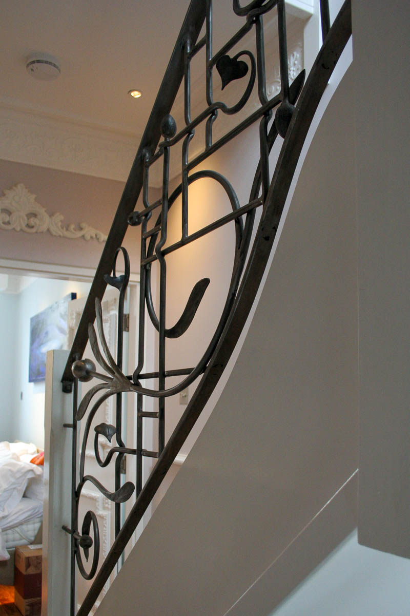 The railings are a creative blend of straight lines juxtaposed with flowing curves